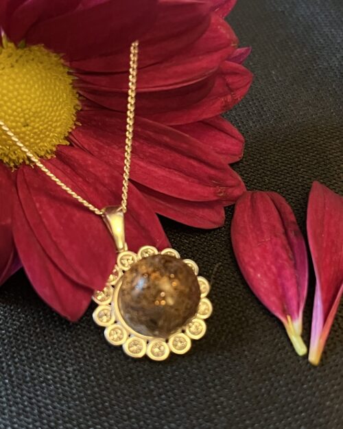 Exquisite CZ pendant and chain encasing cherished flex of hair